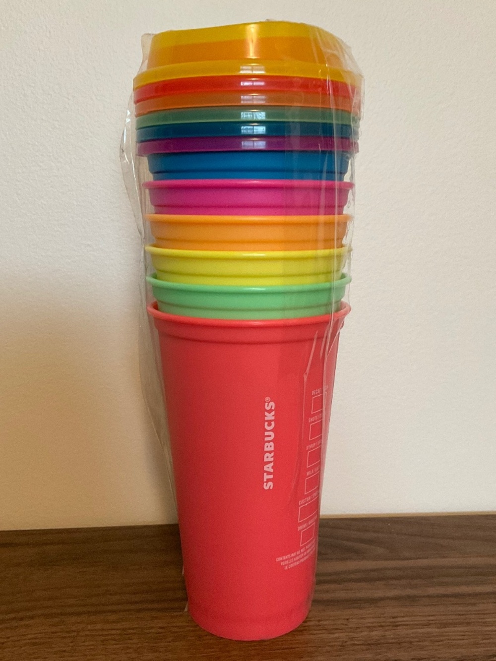Starbucks set of 6 reusable hot cups in bright neon colours with matching lids
